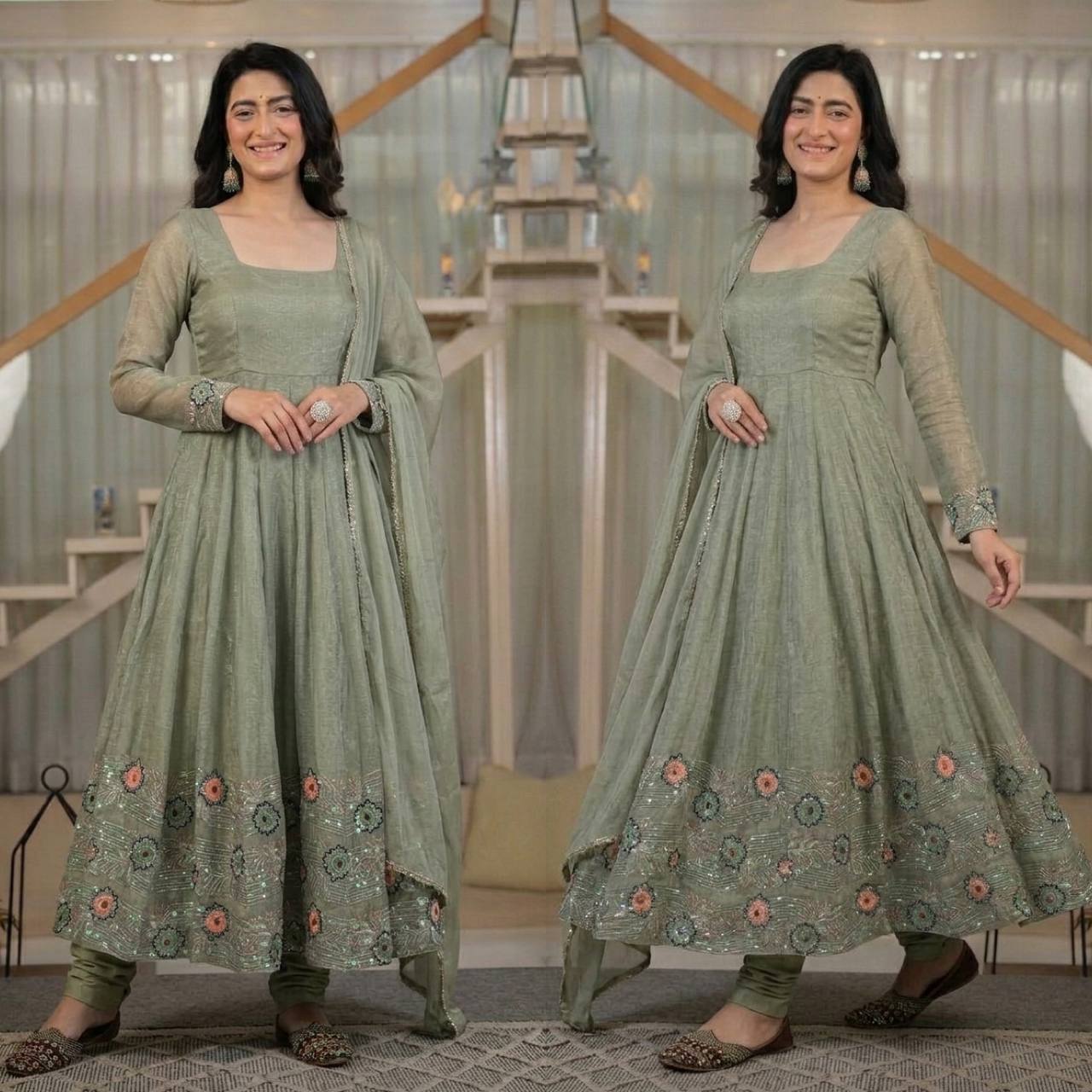 Ethereal Mehendi Green Flared Anarkali Suit Set Adorned with Luminous Sequined Floral Motifs, Embroidered Cuffs, and an Ornate Heritage Hem